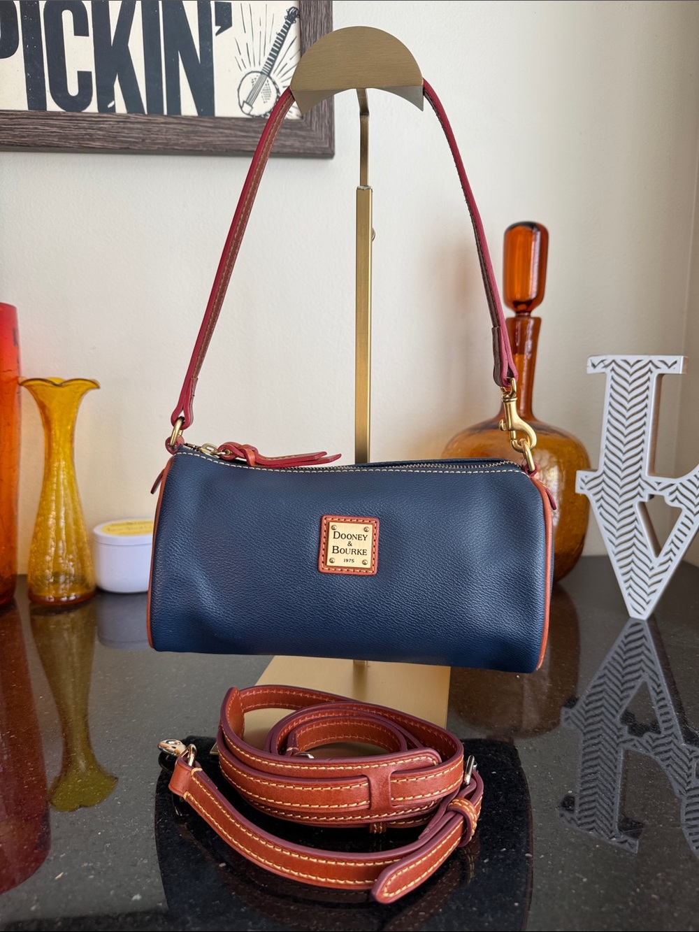 Dooney & Bourke Navy Leather Barrel Bag with Brown Trim and Red Leather Interior